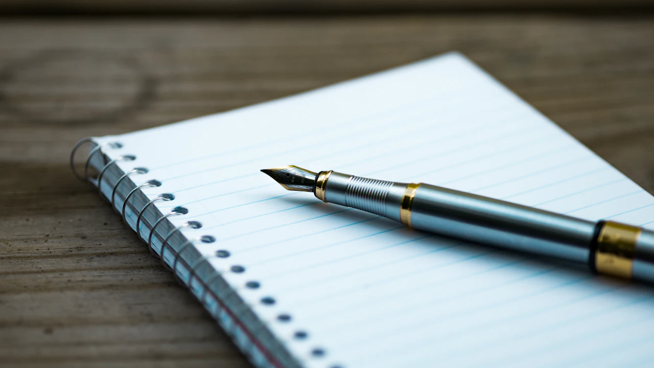 A fountain pen on a notebook