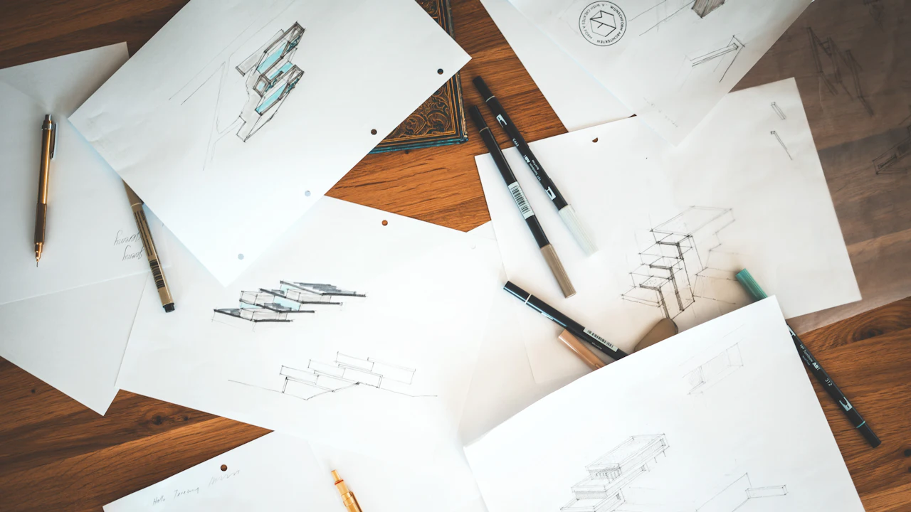 Printed design sketches on a table