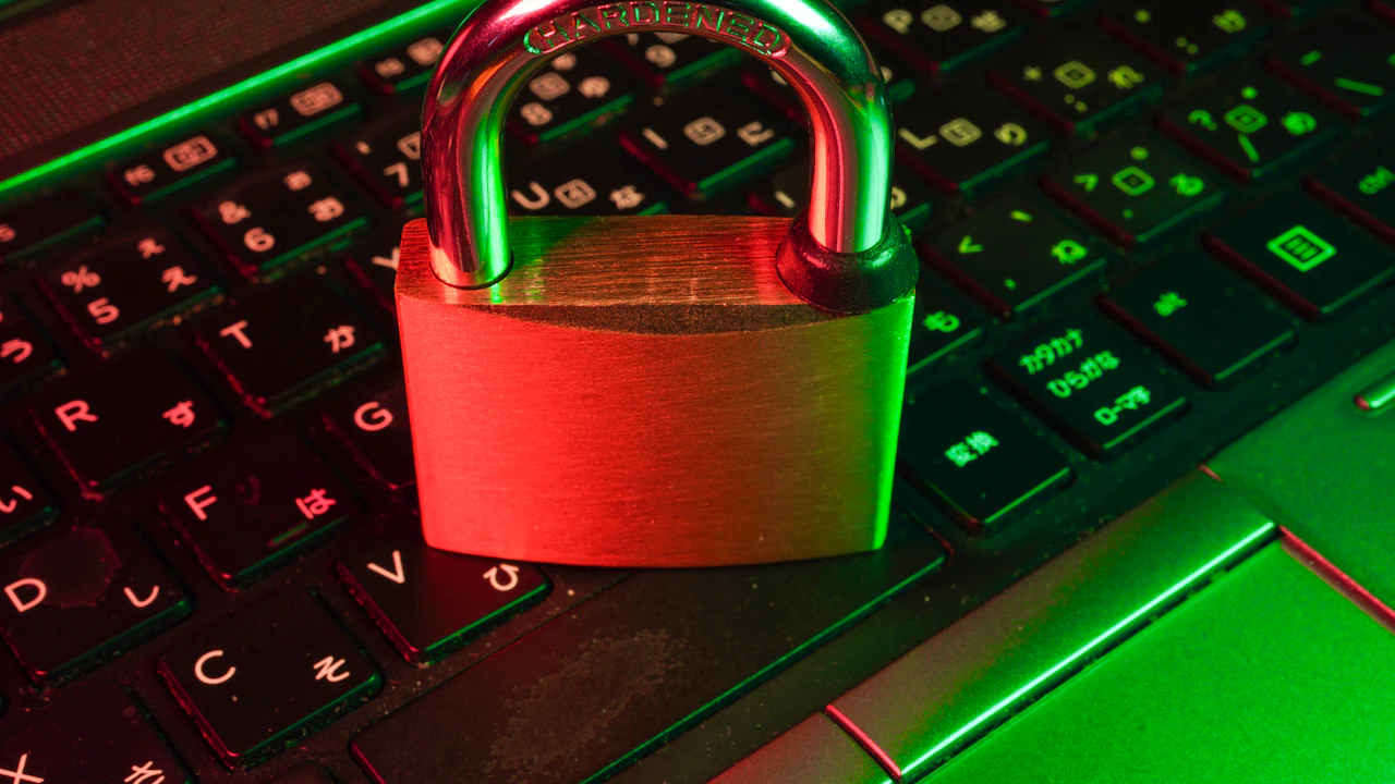A red padlock on a computer keyboard